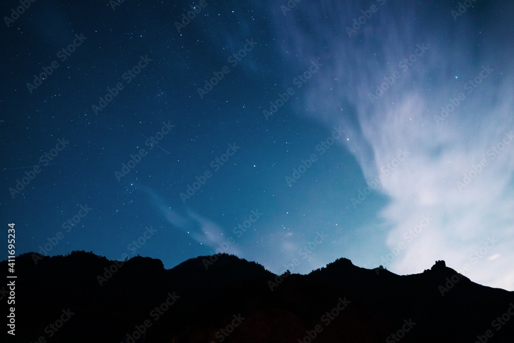 Starry sky over the mountains. Long exposure galaxy night shot. Starry sky over the mountains. Long exposure galaxy night shot.