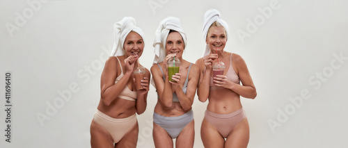 Beautiful middle aged caucasian women with smoothies