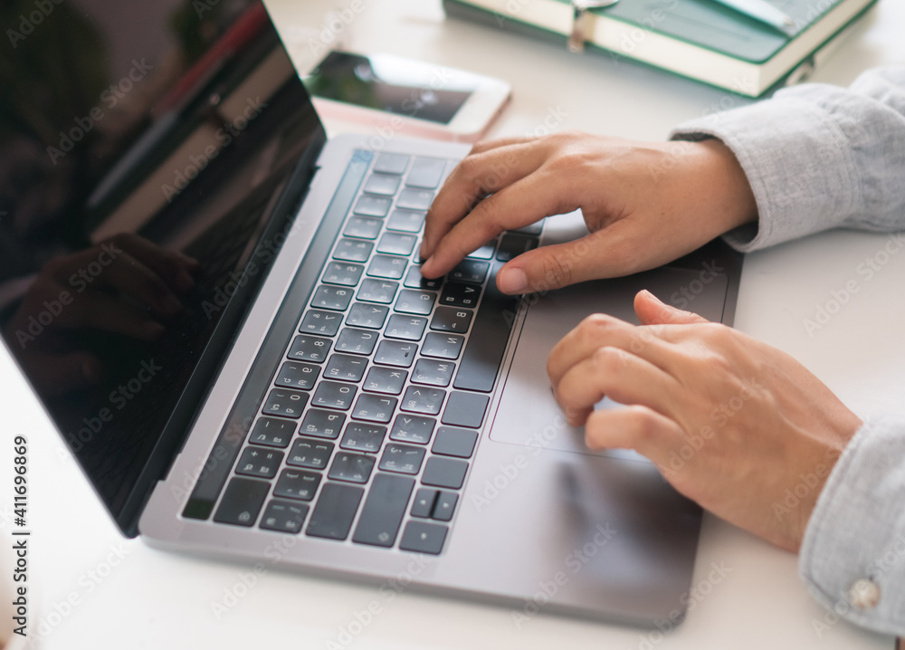 Woman is working on clean nature workspace at home with laptop, planner notebook and calculator. Business finance office. Woman is working on clean nature workspace at home with laptop, planner notebook and calculator. Business finance office.