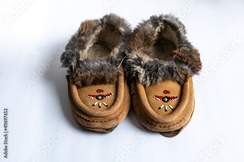 A pair of Indigenous-made, beaded rabbit fur moccasin slippers in Southwestern Ontario, Canada. photo
