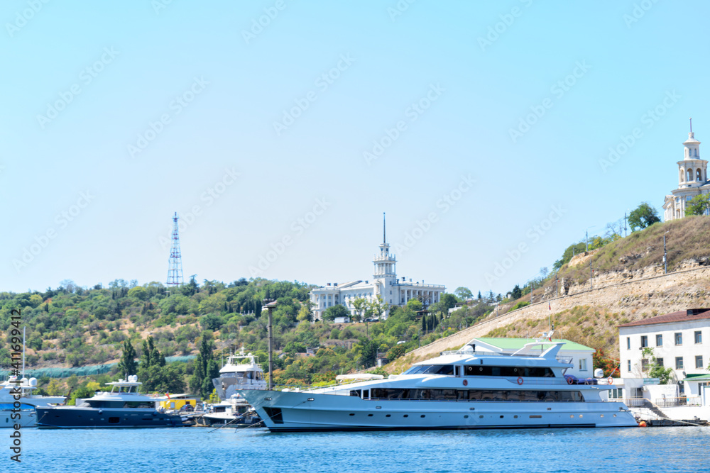 Boats and waves in the sea, hot Crimean summer