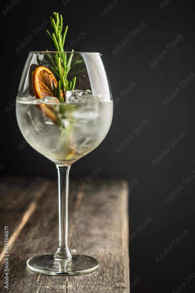 Gin based cocktail with triple sec in wine glass on the rustic background. Selective focus. Shallow depth of field. 