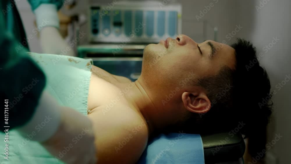 Medium Close Up – A surgeon removes oxygen mask and others surgeons cover a patient’s dead body after unsuccessful operation in hospital operating theater. Medium Close Up – A surgeon removes oxygen mask and others surgeons cover a patient’s dead body after unsuccessful operation in hospital operating theater.