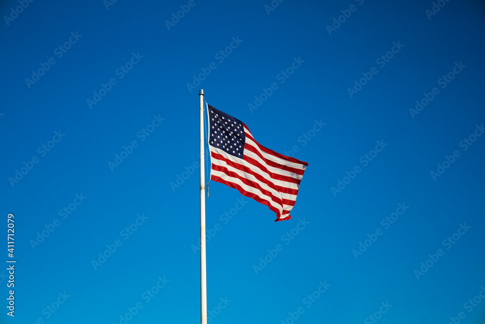 american flag on sky waving in the wind