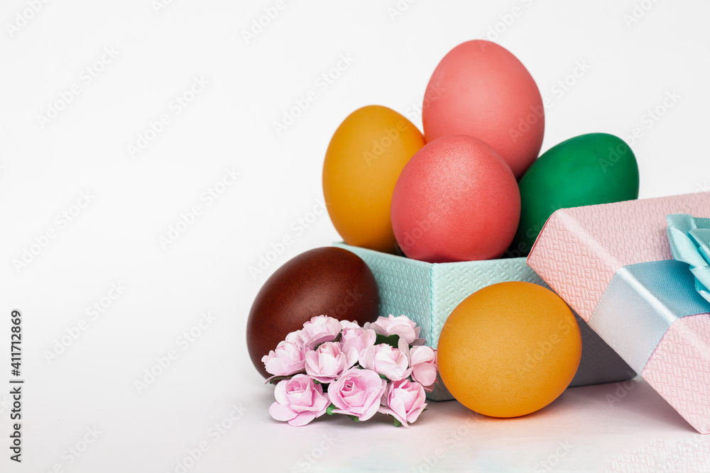 bright multicolored Easter eggs in gift box isolated on white background, copy space bright multicolored Easter eggs in gift box isolated on white background, copy space