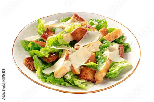 Caesar salad with grilled chicken meat, romaine leaves and Parmesan cheese, isolated on a white background with a clipping path