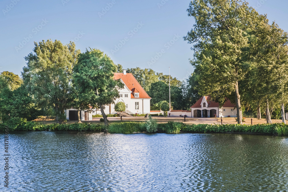 Fototapeta premium Viborg, Denmark, August 2018: Mansion on the river bank in Denmark