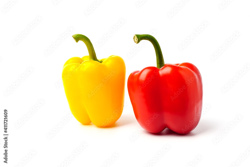 Fresh red and yellow bell peppers isolated on white Fresh red and yellow bell peppers isolated on white