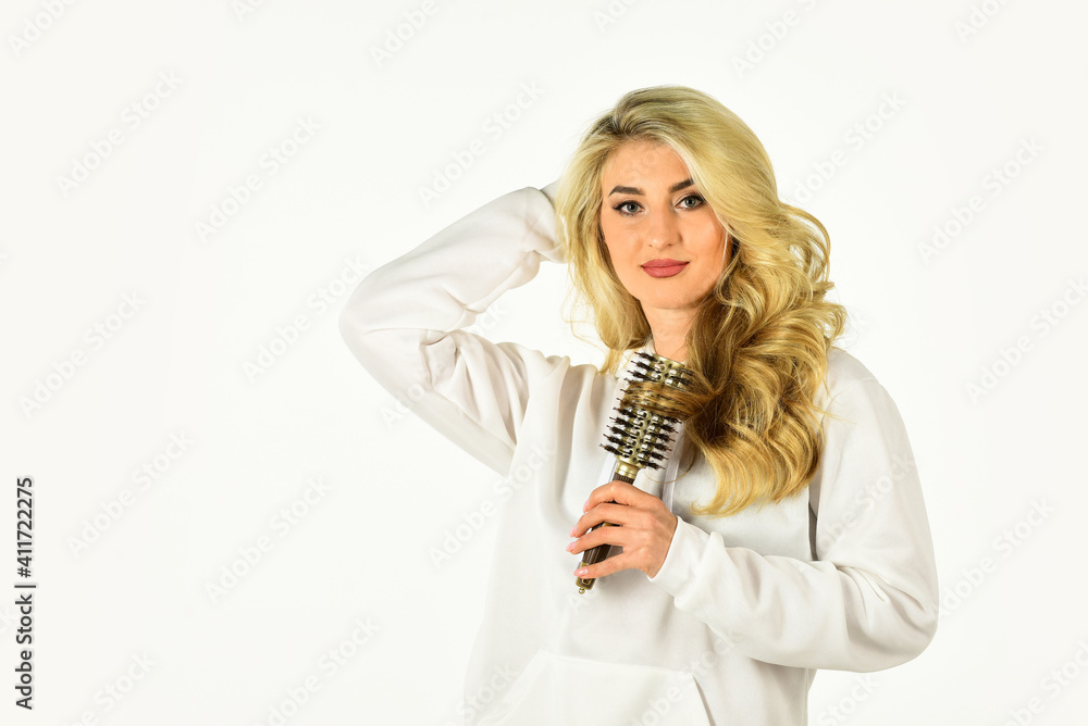 Hot curling brush. Pretty woman brushing hair isolated on white. Long hair. Hair care. Hairdresser salon. Professional equipment. Easy hairdo. Beauty supplies. Use with hairdryer to create styling Hot curling brush. Pretty woman brushing hair isolated on white. Long hair. Hair care. Hairdresser salon. Professional equipment. Easy hairdo. Beauty supplies. Use with hairdryer to create styling