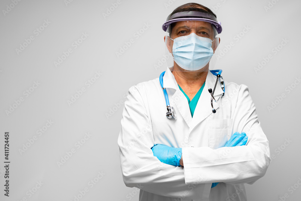 Portrait of middle-aged doctor wearing face shield Portrait of middle-aged doctor wearing face shield