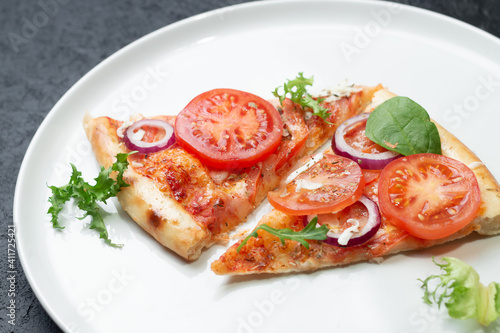 Slices homemade of pizza on a white plate