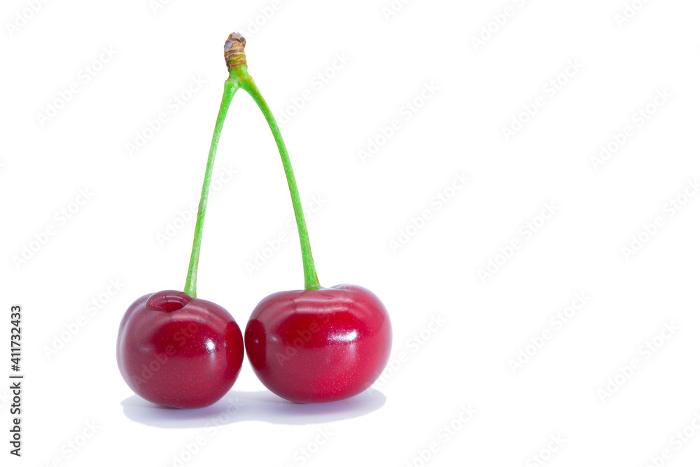 Red cherries on a white background. Isolated image. Red cherries on a white background. Isolated image.