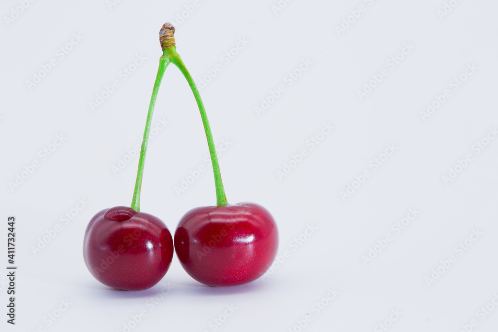 Red cherries on a white background. Red cherries on a white background.