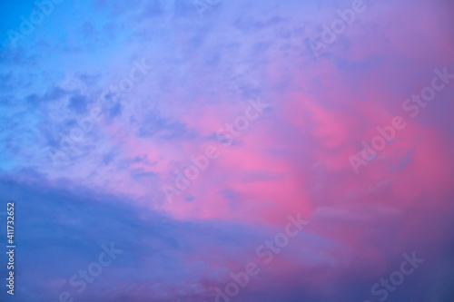 Pink and blue clouds in the evening sky. Background image. Natural background.