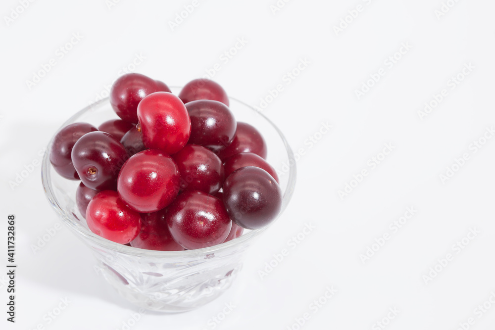 Cherry berries on a white background. Copy space. Cherry berries on a white background. Copy space.