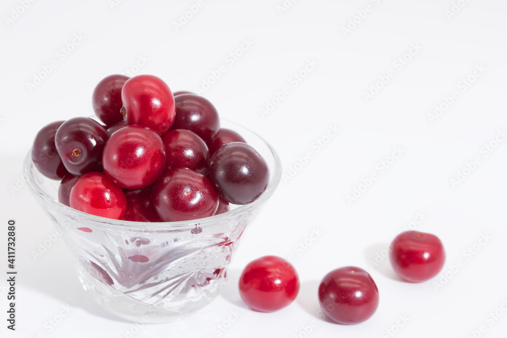 Cherry berries on a white background. Copy space. Cherry berries on a white background. Copy space.