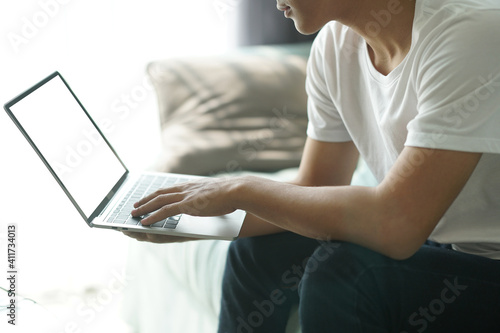 asian young student man entrepreneur working with computer studying learning online at home. e-learning webinar meeting. social distance in covid pandemic