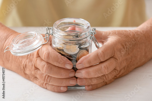 Senior woman with savings i...