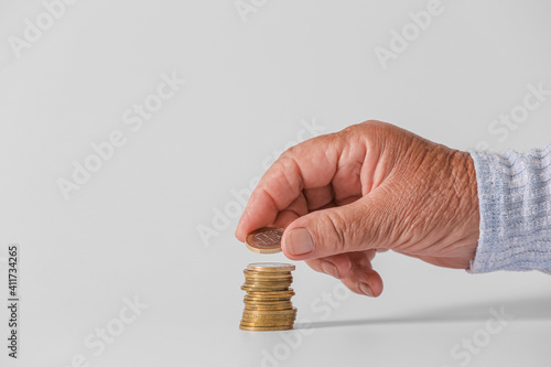 Hand of senior woman with c...
