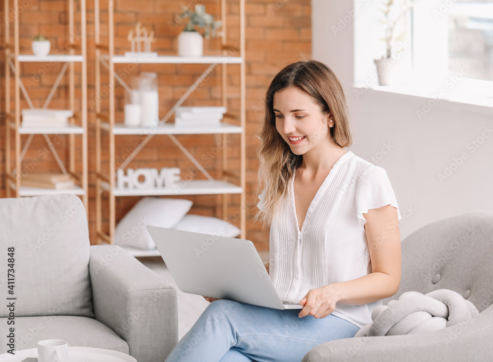 Young woman with laptop at home Young woman with laptop at home