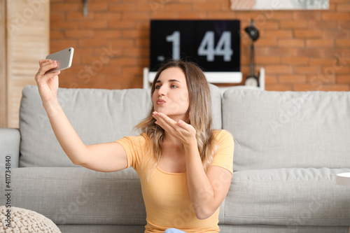 Young woman with mobile pho...