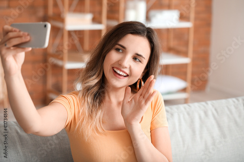 Young woman with mobile pho...