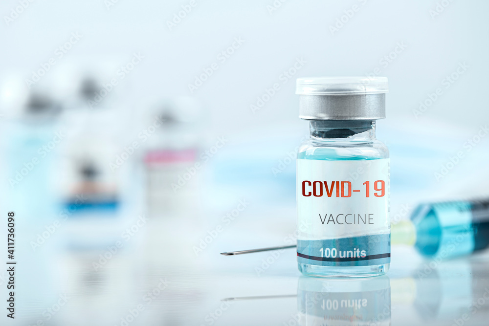 Blue vaccine jar bottle and syringe injection for treatment from corona virus infection and build immunity to viruses Covid-19 , Healthcare And Medical concept. Blue vaccine jar bottle and syringe injection for treatment from corona virus infection and build immunity to viruses Covid-19 , Healthcare And Medical concept.