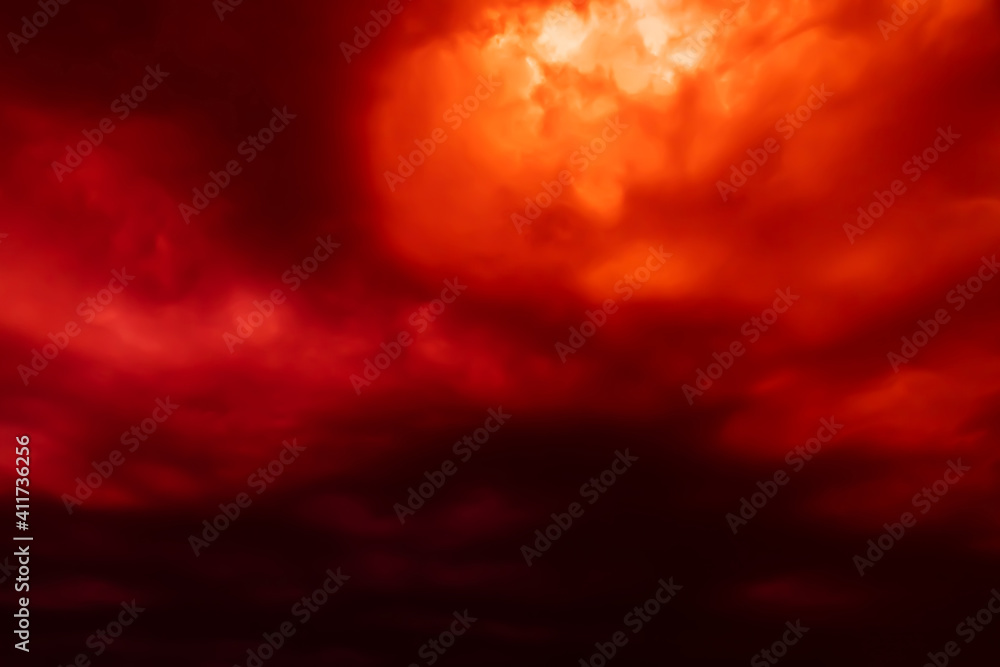 Fantastic concept mystical horror background from another planet from the paranormal world, fantasy style. Dramatic red black orange sky with scary hellish clouds and terrible shadows and light