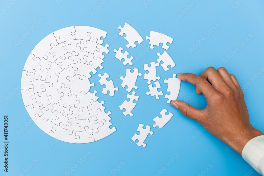 Pieces of jigsaw puzzle in man's hands, Business solutions, success and strategy concept. Pieces of jigsaw puzzle in man's hands, Business solutions, success and strategy concept.