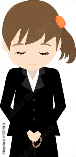 葬儀に参列しておじぎする娘(上半身)