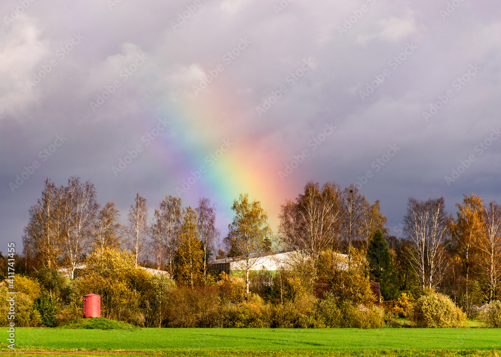 autumn landscape with a rainbow over beautiful colorful trees autumn landscape with a rainbow over beautiful colorful trees
