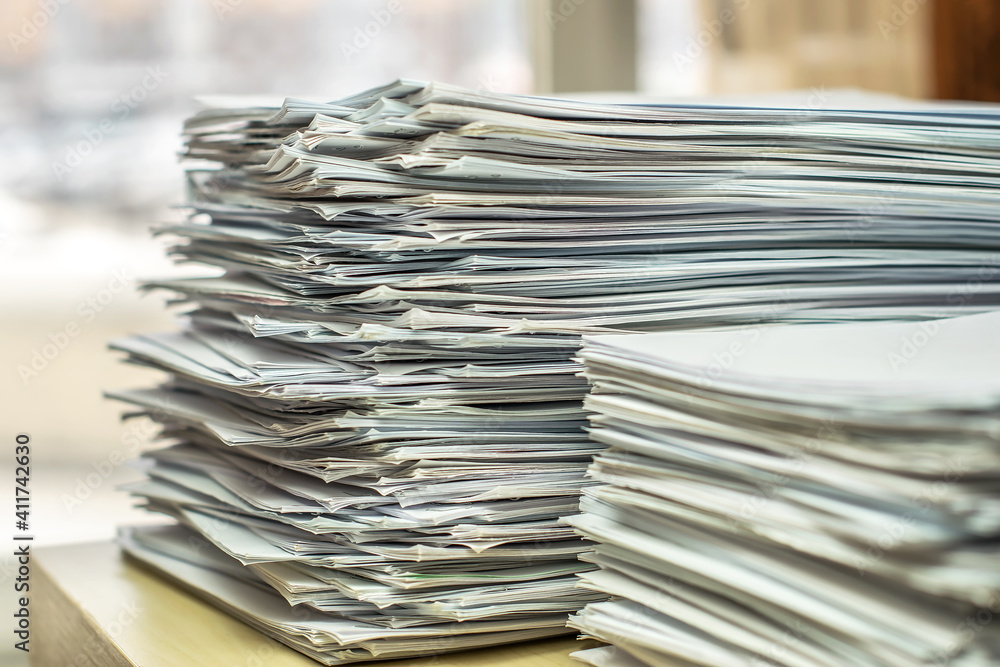 pile of paper documents in the office pile of paper documents in the office