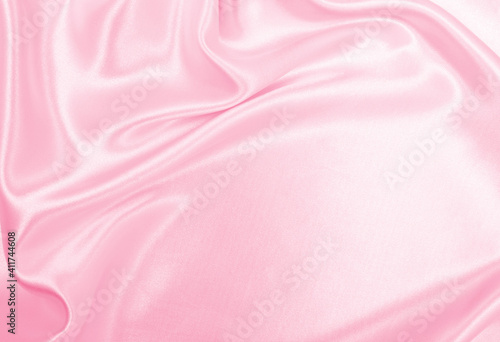 Smooth elegant pink silk or satin texture as wedding background. Luxurious background design