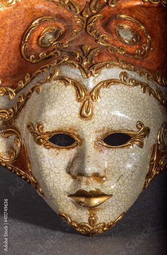 Traditional venetian carnival mask on grey background