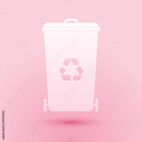 Paper cut Recycle bin with recycle symbol icon isolated on pink background. Trash can icon. Garbage bin sign. Recycle basket icon. Paper art style. Vector.