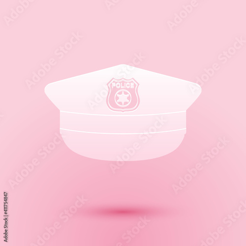 Paper cut Police cap with cockade icon isolated on pink background. Police hat sign. Paper art style. Vector.