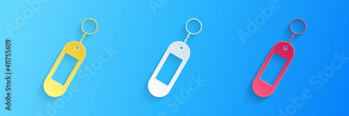 Paper cut Key chain icon isolated on blue background. Blank rectangular keychain with ring and chain for key. Paper art style. Vector.