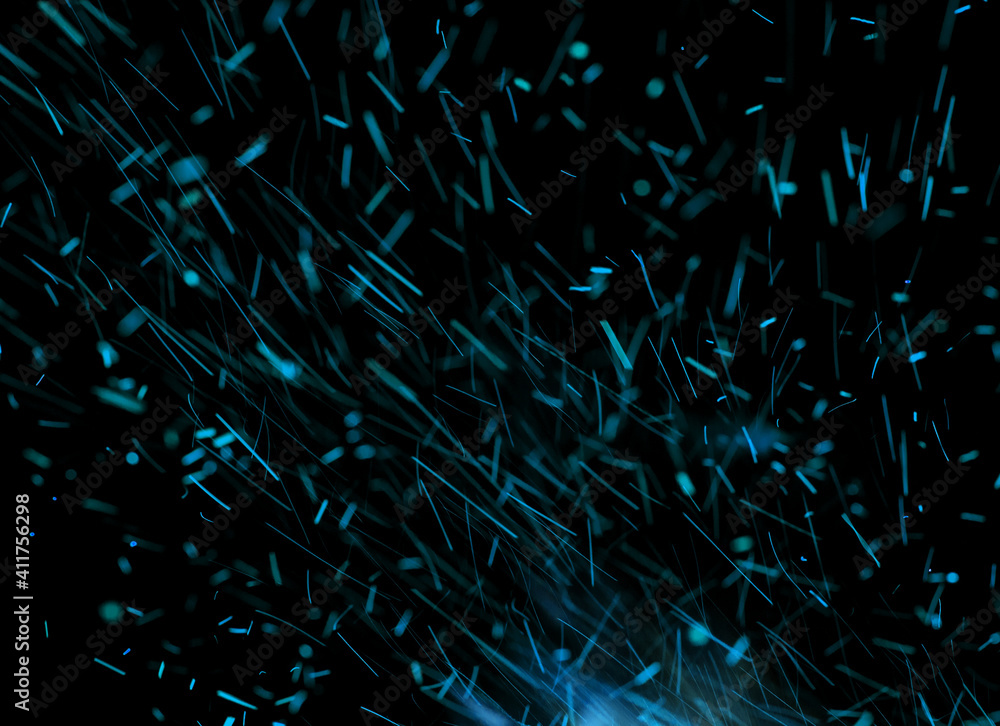 blue sparks of fire on black background