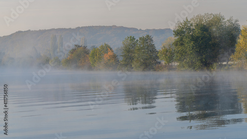 Early morning mist at the shore of the River Ruhr in Muelheim an der Ruhr, North Rhine-Westfalia, Germany
