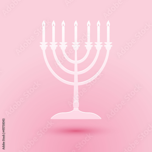 Paper cut Hanukkah menorah icon isolated on pink background. Religion icon. Hanukkah traditional symbol. Holiday religion, jewish festival of Lights. Paper art style. Vector.