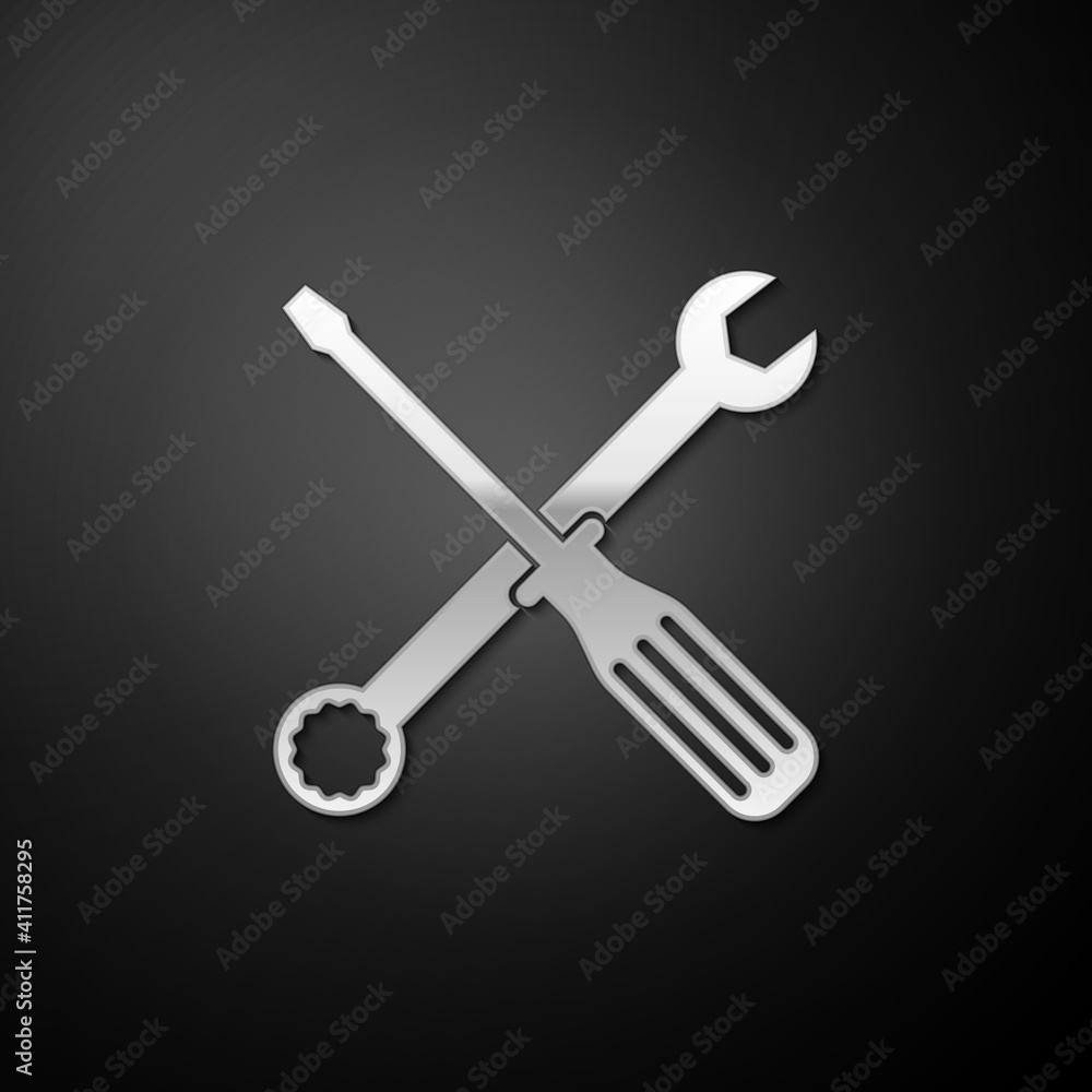 Silver Spanner and screwdriver tools icon isolated on black background. Service tool symbol. Long shadow style. Vector.