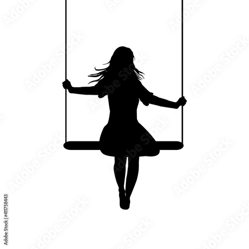 A young woman silhouette who is swinging