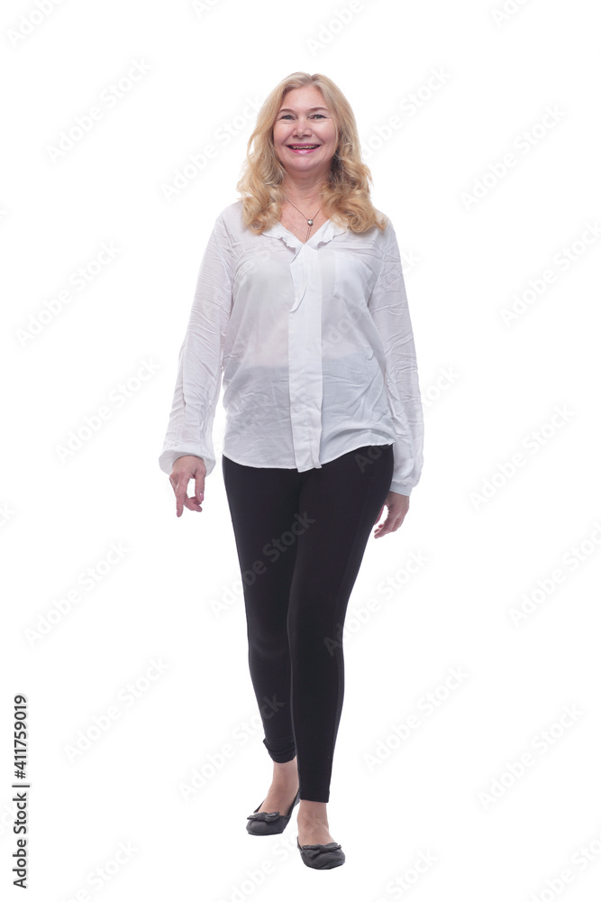 happy mature woman in a new blouse striding forward. happy mature woman in a new blouse striding forward.