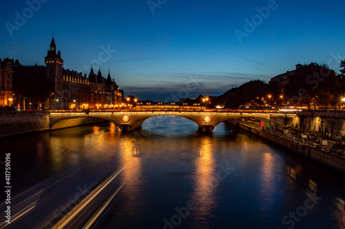 Paris, France - July 20, 2019: Night view of River Seine and Bridge of Change (Pont au Change) in Paris, France