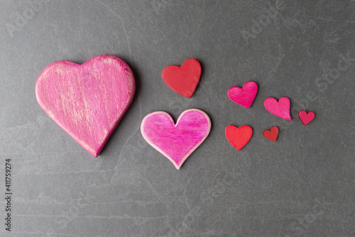 Various Valentine   s hearts on grey stone background