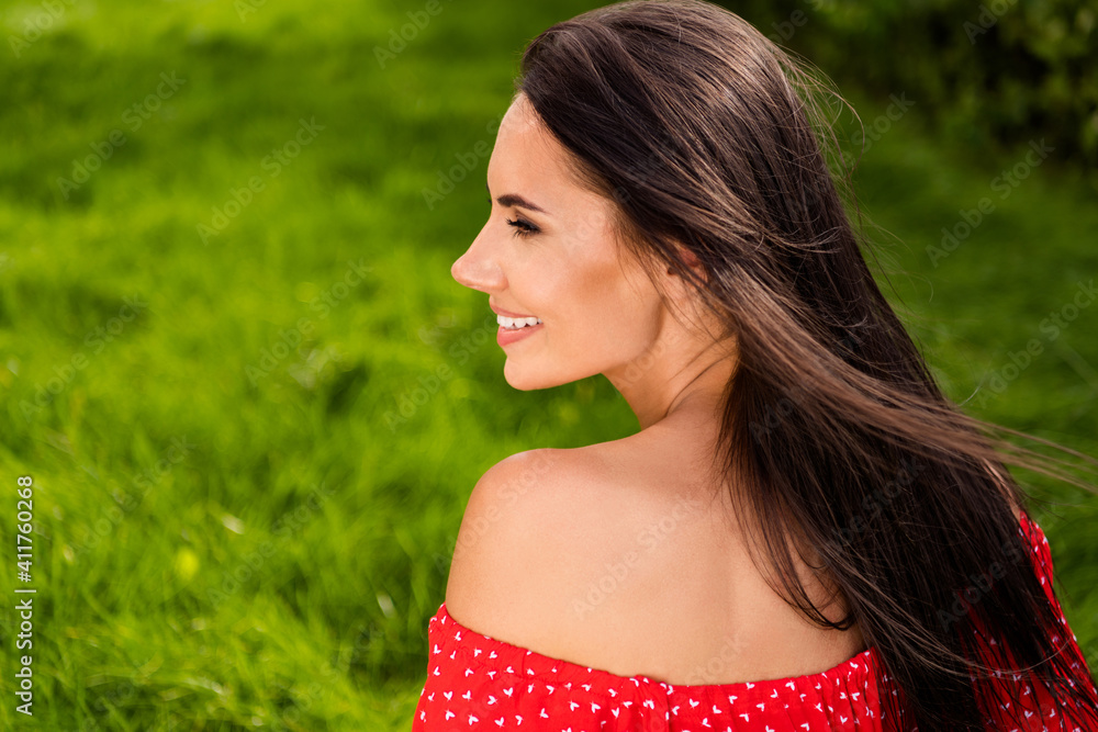 Bck rear spine view photo of positive attractive brunette woman look dream summer weekend outside in park outdoors Bck rear spine view photo of positive attractive brunette woman look dream summer weekend outside in park outdoors