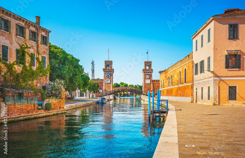 Venice cityscape, water canal, bridge and gate of medieval Venetian Arsenal. Italy