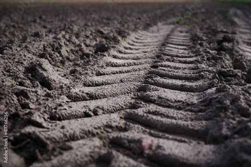 Trail track of tractor on plowed field © Lazy_Bear