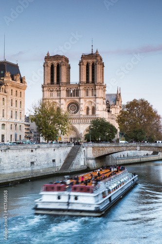 Tour boat near Notre Dame at sunset, Paris