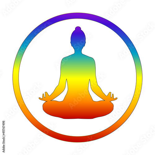 Silhouette of yogi in lotus position in chakra colors